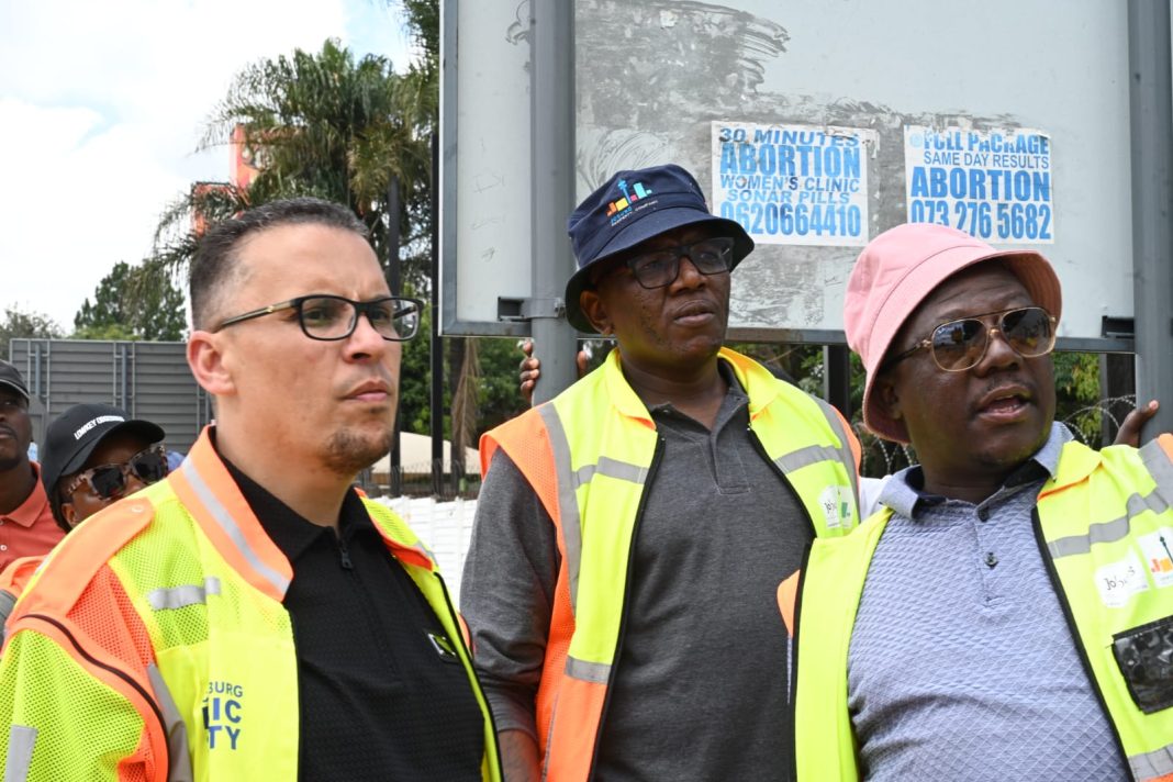 Johannesburg city officials action against illegal outdoor.